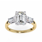 Load image into Gallery viewer, emerald solitaire with baguette three stone engagement ring
